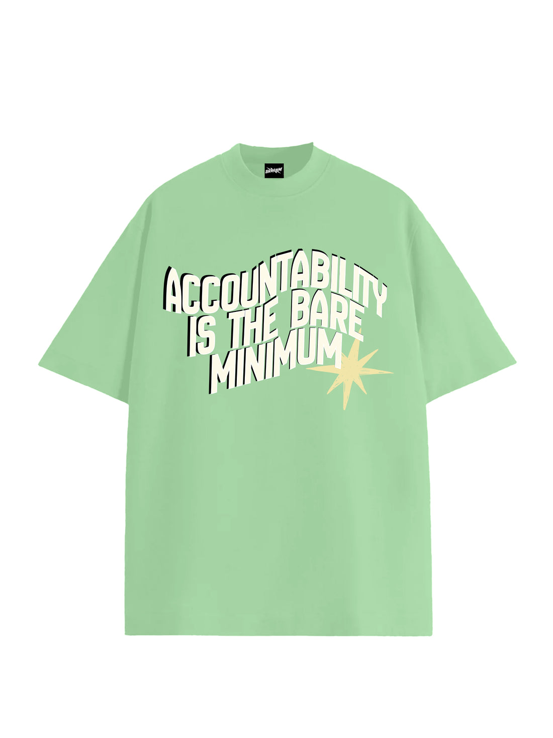 A light green short-sleeve t-shirt with a graphic text print reading 'ACCOUNTABILITY IS THE BARE MINIMUM' in white and black, accented by a yellow starburst on the front, shown against a plain white background 2026 protest cockroach janta party cjp