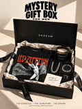 SKREAM Mystery Gift Box for Men — illustrative open box with mystery tee, accessories and candle; pictured designs are not guaranteed