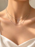 Silver star pendant two-layer necklace on model in sunlight | SKREAM
